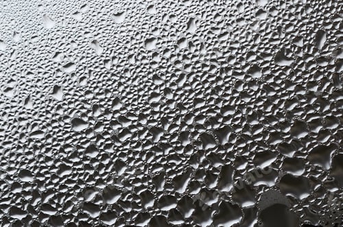 Preview: A photo of the glass surface of the window, covered with a multitude of droplets
