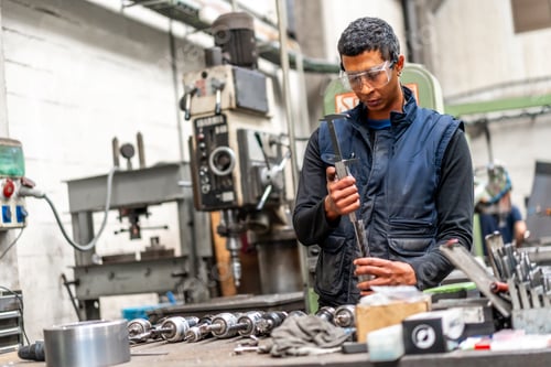 Preview: Latino worker in the metal industrial factory trade in the numerical control sector