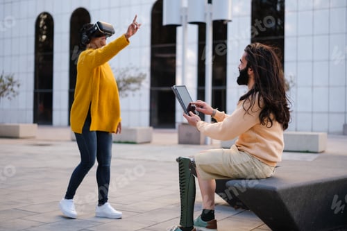 Preview: Two workers using virtual reality to do their work outdoors. Concept: technology, investment