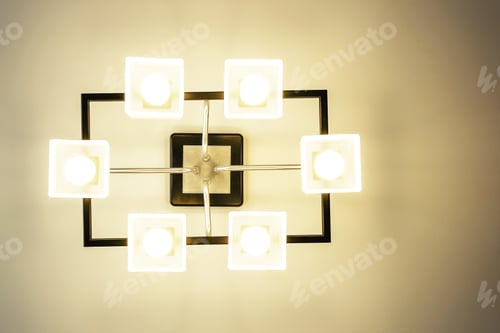 Preview: Modern Geometric Ceiling Light Fixture Illuminating a Home