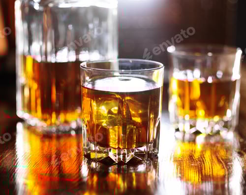 Preview: two glasses of whiskey with decanter