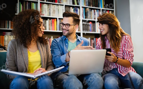 Preview: Young university students studying together. Group of multiracial friends in college
