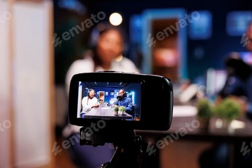 Preview: Digital camera filming a home talk show