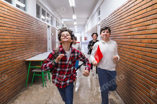 Preview: Group of elementary school students running in school hallway