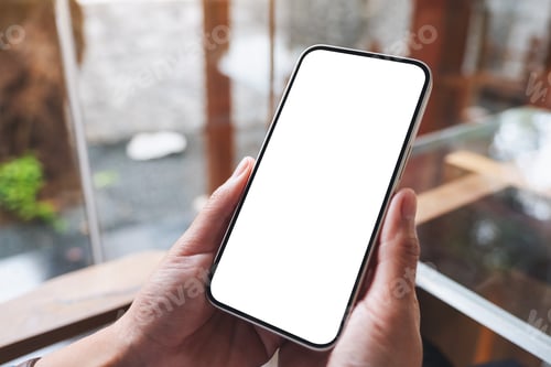 Preview: Mockup image of hands holding mobile phone with blank desktop screen