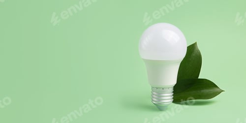 Preview: Led bulb with frsh green leafs,green energy concept.Large banner with negative space.