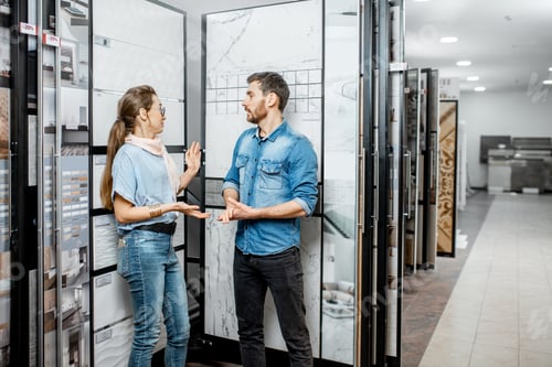 Preview: Couple choosing ceramic tiles in the shop