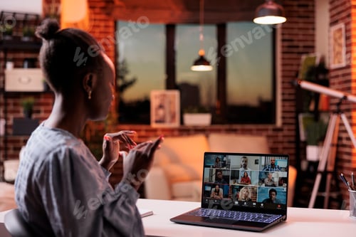 Preview: Corporate worker chatting with remote team on videocall