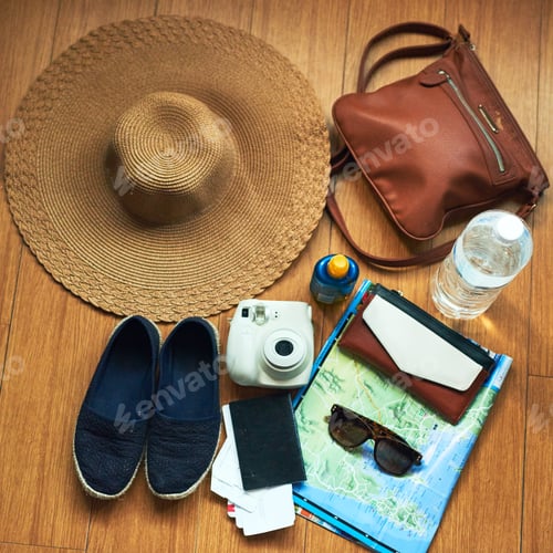 Preview: The tourists essentials. High angle shot of travelling essentials on a table.