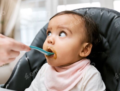 Preview: Shot of a mother feeding her adorable baby girl