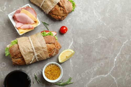 Preview: Concept of tasty eating with ciabatta sandwiches on gray textured table