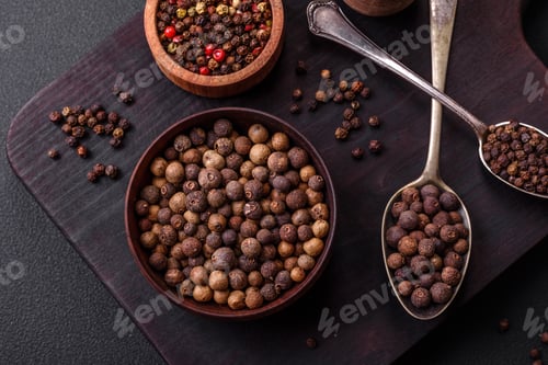 Preview: Spice allspice brown color not ground in a wooden saucer. Asian food