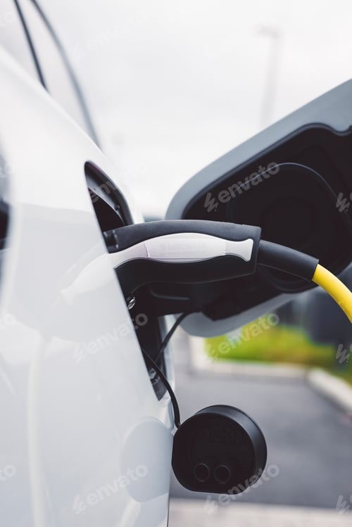 Preview: The electric car charger plugged in to the socket, the modern electric car charging