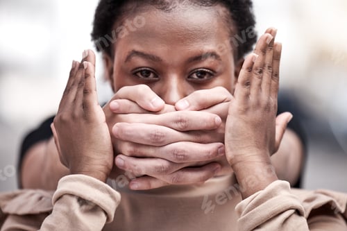 Preview: Young women shouldnt be silenced. Shot of a young woman being silenced during a protest.