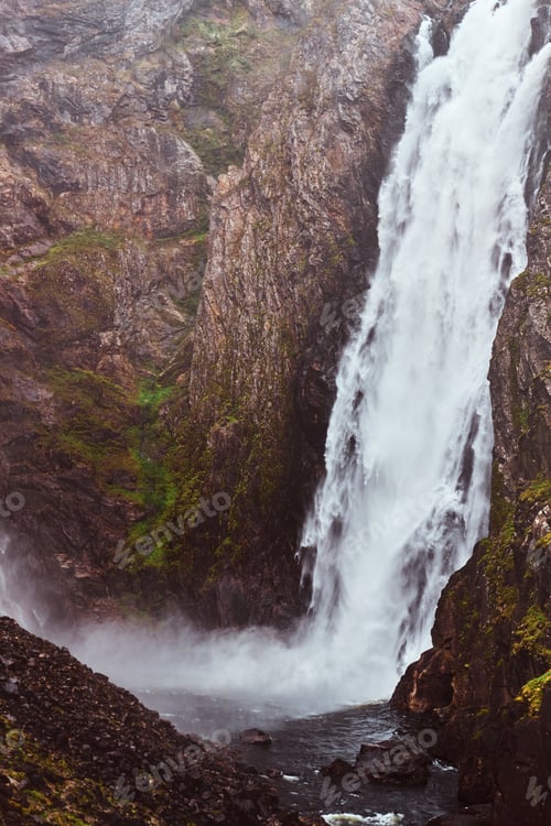 Preview: Waterfall in rocky mountains. Amazing nature in Norway.