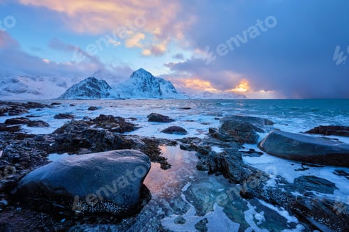 Preview: Coast of Norwegian sea on rocky coast in fjord on sunset