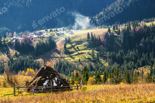 Preview: A large haystack against the backdrop of the wonderful nature of the Carpathians and the