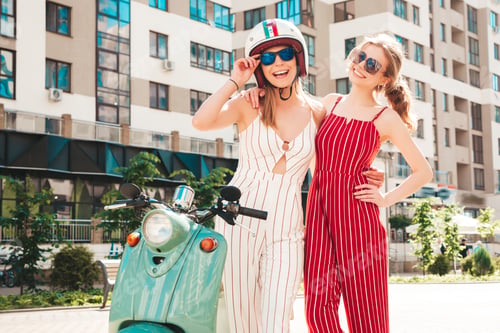 Preview: Two young beautiful woman posing outdoors