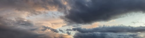Preview: Dramatic View of a cloudscape during a dark, rainy and colorful sunset