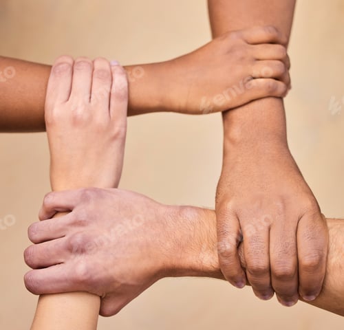 Preview: High angle shot of a diverse group of businesspeople holding each others wrists in the office