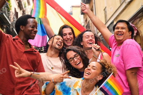 Preview: A group of people having fun and laughing with LGBTQ rainbow flags.