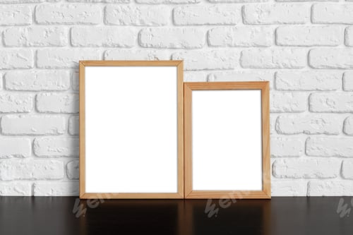 Preview: Blank picture frame against brick wall with copy space