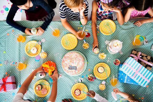 Preview: Group of diverse cheerful kids enjoying a party
