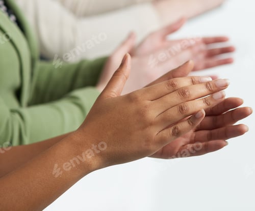 Preview: Shot of a group of unidentifiable people applauding against a white background