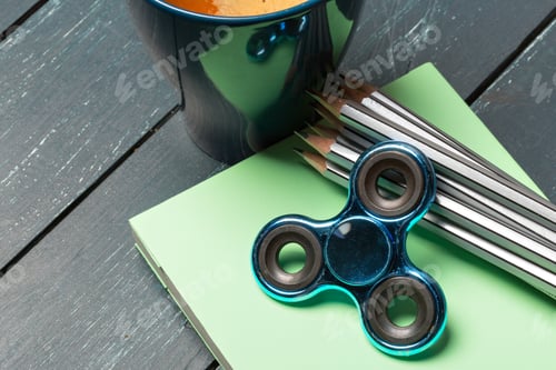 Preview: Workplace with coffee cup, spinner and book