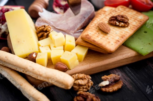 Preview: Assorted cheese pieces, vegetables, honey, fruits, cookies and nuts