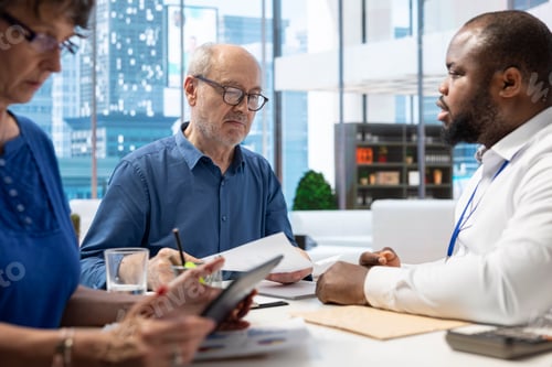 Preview: Senior couple engaged in consultation with a financial advisor
