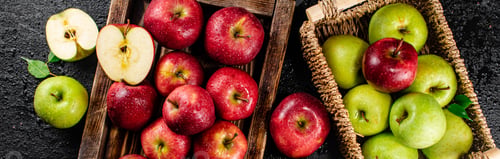 Preview: An assortment of red and green apples on the table.