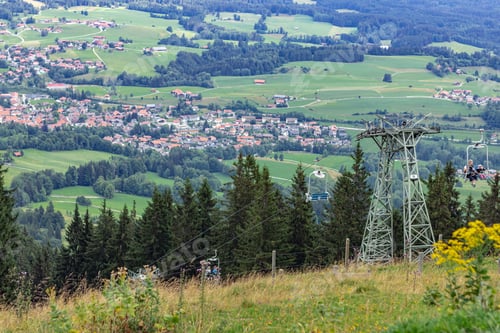 Preview: view from the mountain to the village at the foot and the ski lift