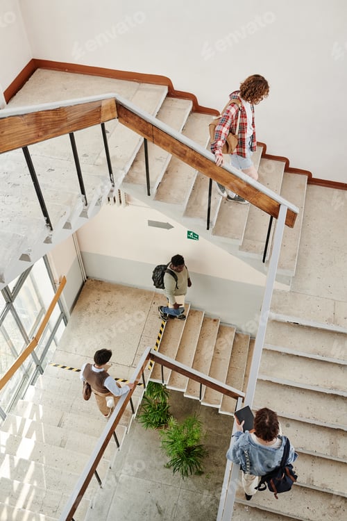 Preview: Above angle of teenage students of highschool moving upstairs and downstairs