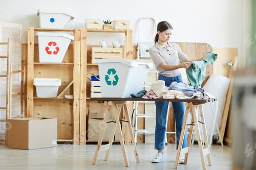 Preview: Woman sorting the clothes