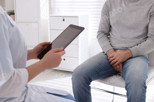 Preview: Man having appointment with STD specialist in clinic, closeup