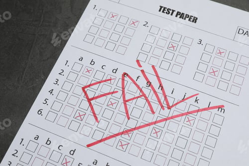 Preview: Answer sheet with word Fail on gray textured table, closeup. Student passing exam