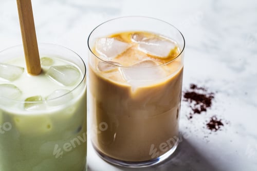 Preview: Cold summer drinks concept. Ice latte matcha and ice latte coffee in glasses, white background.