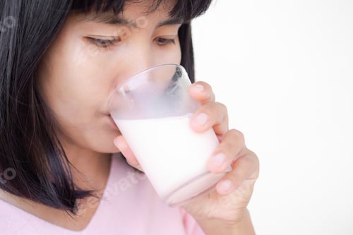 Preview: Woman drinking milk from glass close up on white bakcground