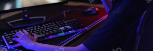 Preview: Female cyber hacker gamer in headphones making win gesture after hacking programming system success