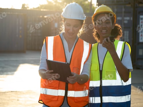 Preview: Foreman female woman engineer girl yellow white hardhat helmet safety person people group talk discu