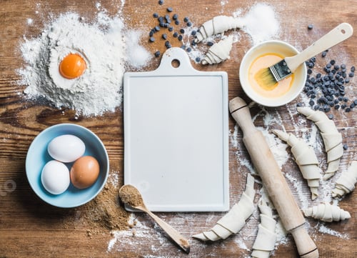 Preview: Baking ingredients for cooking croissants with white board in center
