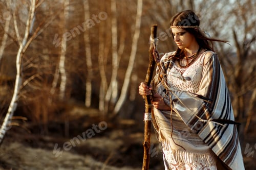 Preview: native indian american woman shaman on hill in sunset evening mountains