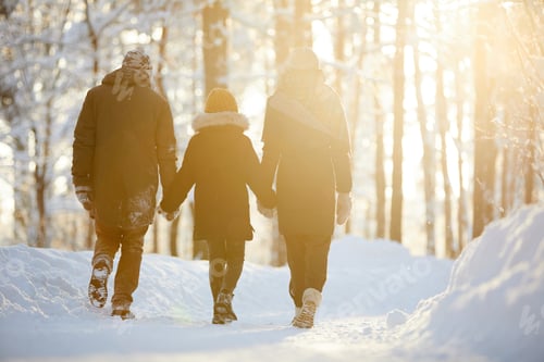 Preview: Family Enjoying Walk in Winter Forest