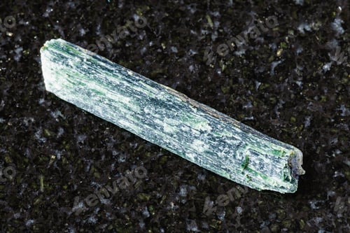 Preview: sample of raw chrysotile mineral on black granite