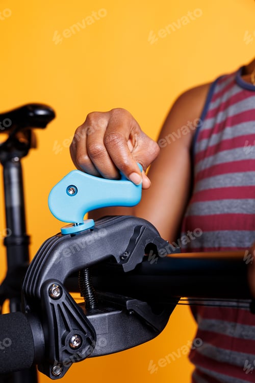 Preview: Female Cyclist Fixes Bicycle on Stand