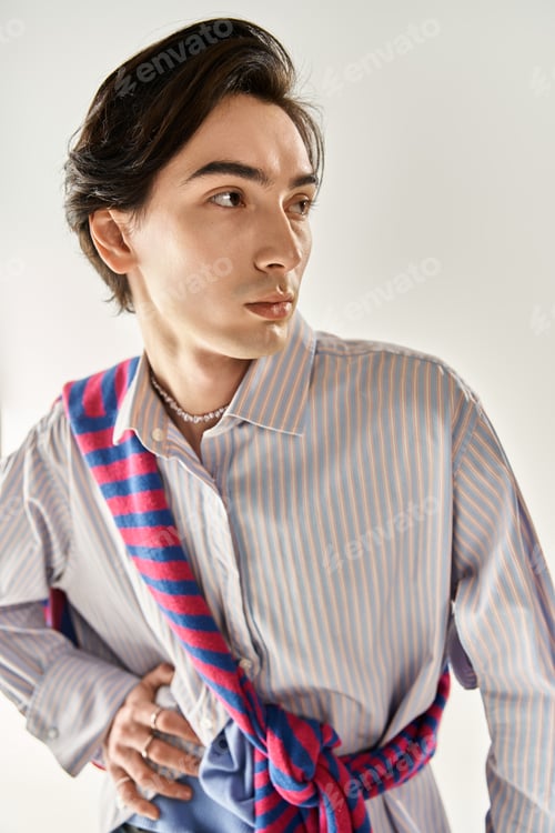 Preview: Fashionable non binary youth embraces style and identity in a modern urban setting
