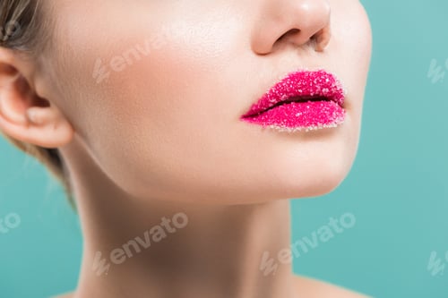 Preview: cropped view of young woman with sugar on lips isolated on blue