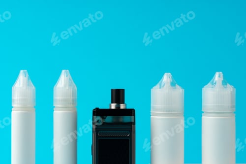 Preview: Electronic cigarettes liquid bottles on blue background