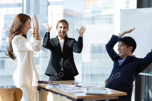 Preview: Group office colleagues having casual discussion during meeting in conference room.